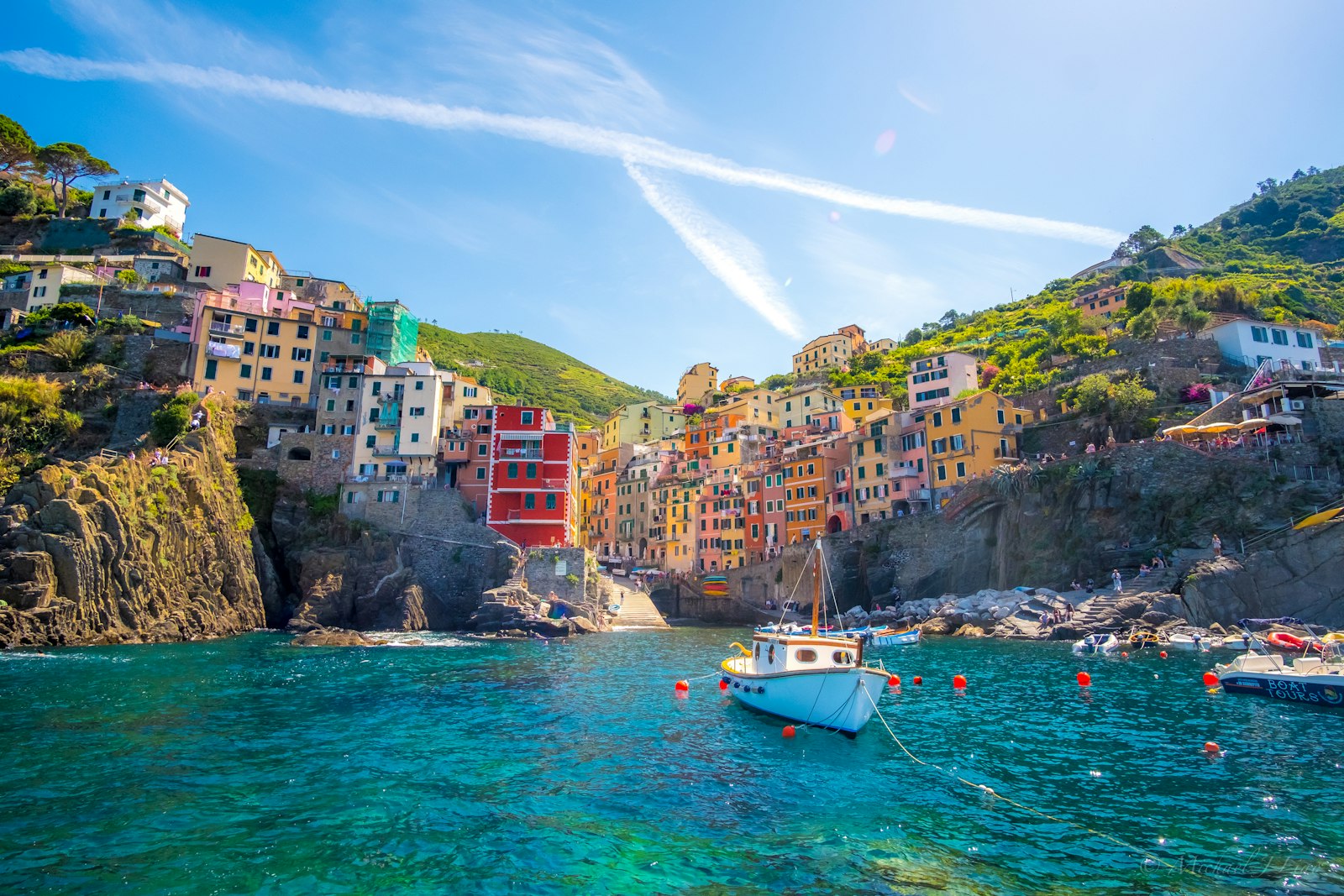 Pastel cliffside village of the Cinque Terre above the Ligurian Sea at golden hour